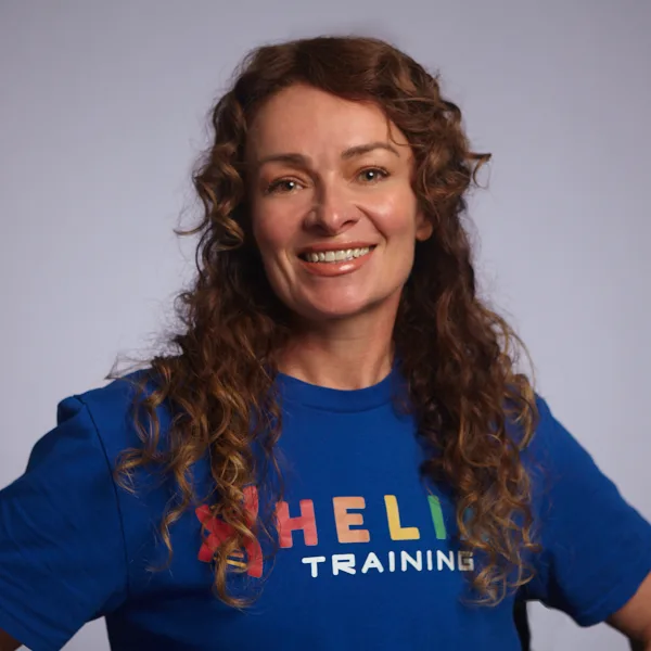Headshot of Amy Clem smiling in a blue Helix Training shirt.