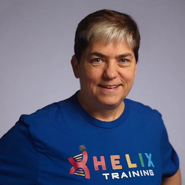 Headshot of Dr. Kathy Lynch smiling in a blue Helix Training shirt.