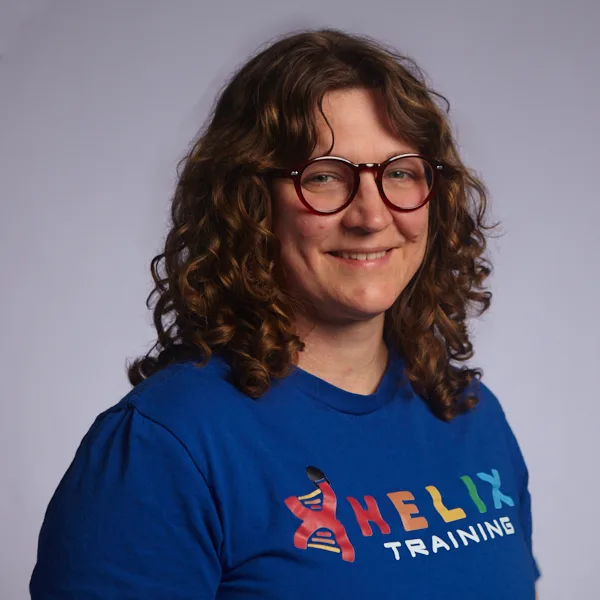 Headshot of Rebecka Weinsteiger smiling in a blue Helix Training shirt.